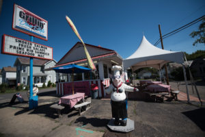 The iconic pig statue, Sir David Lee, stands righteously outside of Grillin' Dave Style.