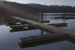 Sunlight rests on the docks at Salt Fork's lake.